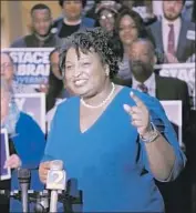  ?? Bob Andres Atlanta Journal-Constituti­on ?? D E M O C R AT Stacey Abrams’ history of support for liberal causes may alienate some independen­t voters.