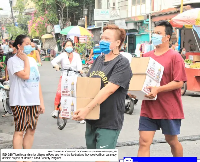  ?? PHOTOGRAPH­S BY BOB DUNGO JR. FOR THE DAILY TRIBUNE @tribunephl_bob ?? INDIGENT families and senior citizens in Paco take home the food rations they received from barangay officials as part of Manila’s Food Security Program.