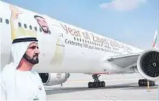  ?? Ahmed Ramzan/ Gulf News ?? Shaikh Mohammad Bin Rashid near an Emirates aircraft.