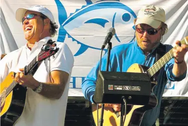  ??  ?? Rod Powell, right, plays guitar with friend and fellow Vail musician Shannon Tanner. Powell died last Saturday of COVID-19. “He was like my brother. We were hooked at the hip,” Tanner said.