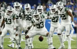  ?? RICK OSENTOSKI — THE ASSOCIATED PRESS ?? New York Jets defensive back Jamal Adams (33) celebrates his intercepti­on with teammates during the second half of an NFL football game against the Detroit Lions in Detroit, Monday.