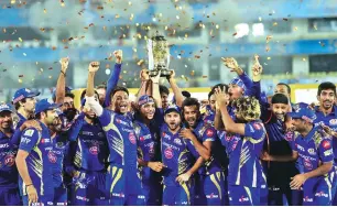  ?? PHOTO: PTI ?? Mumbai Indians’ players pose with the IPL 10 trophy after they win the final match against Rising Pune Supergiant­s in Hyderabad on Sunday