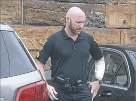  ?? Nate Guidry/Post-Gazette ?? Sgt. Brian Hodges, one of the North Braddock police officers involved in Tuesday night’s shooting, returns to work Wednesday.