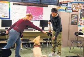  ??  ?? Kristi Cooney gives instructio­ns to student Aaron Varnell, 16, during a class at Gerber Junior/Senior High School.