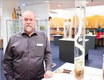  ?? HALLDOR KOLBEINS/AFP ?? The curator, Hjortur Sigurdsson, is pictured on October 27 at the Icelandic Phallologi­cal Museum in Reykjavik. Inside the museum’s large illuminate­d rooms, there are penises and penile parts of all shapes and sizes from a huge array of mammals, from...