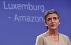  ?? EMMANUEL DUNAND/AFP/GETTY IMAGES ?? Margrethe Vestager, the EU official in charge of antitrust issues, said Amazon had unfairly profited from special low-tax conditions since 2003.