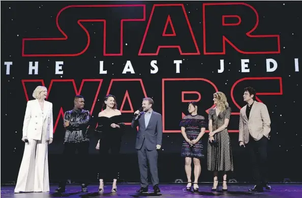  ?? JESSE GRANT/GETTY IMAGES ?? Star Wars: The Last Jedi drummed up excitement at the recent D23 Expo in California with actors Gwendoline Christie, left, John Boyega, Daisy Ridley, director Rian Johnson, and actors Kelly Marie Tran, Laura Dern and Benicio Del Toro on hand for a...