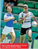  ??  ?? Dinuk Amarasingh­e jogs on to score a try against Chinese Taipei