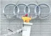  ?? DEREK RUTTAN/POSTMEDIA NETWORK ?? Kevin Painter of Brian Dudley Ltd. installs the logo on the Audi dealership building in London, Ont.