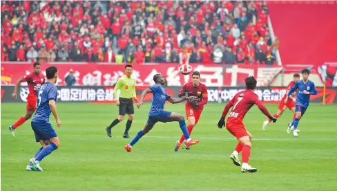  ?? ?? Shenhua and Port players in action during their first clash in 2024.
— CFP