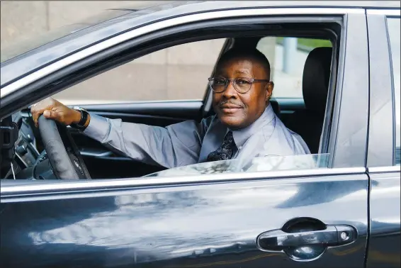  ?? (AP/Luis Andres Henao) ?? Pastor Kenneth Drayton of Mantels of Promise Ministries sits for a portrait Nov. 15 inside his car in New York. “You don’t always have to go to a church or sanctuary to experience the restoratio­n and the power of God,” said Drayton, 61, an ordained minister who also drives part-time for a ride-hailing service.