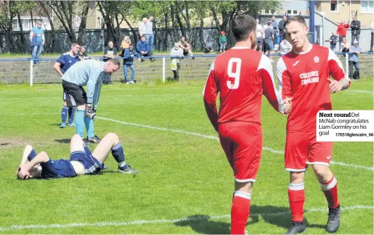  ?? 170518glen­cairn_06 ?? Next roundDel McNab congratula­tes Liam Gormley on his goal