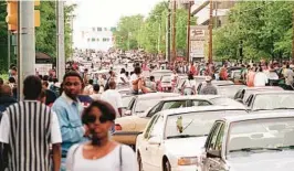  ?? JOHN SPINK/ATLANTA JOURNAL-CONSTITUTI­ON ?? Freaknik revelers bring traffic on Lenox Road in Atlanta to a standstill in 1995.