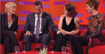  ??  ?? Awkward: Sandler touches Miss Foy’s knee, watched by Emma Thompson and Cara Delevingne