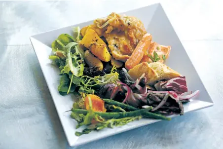  ?? New Mexican ?? A chicken and salmon French-themed dish with local greens featured at a recent SFO preview dinner; right, Natasha Kaelesch and her husband, Nicholas Kaelesch, attend their first tailgate at Santa Fe Opera; photos Luis Sánchez Saturno/The