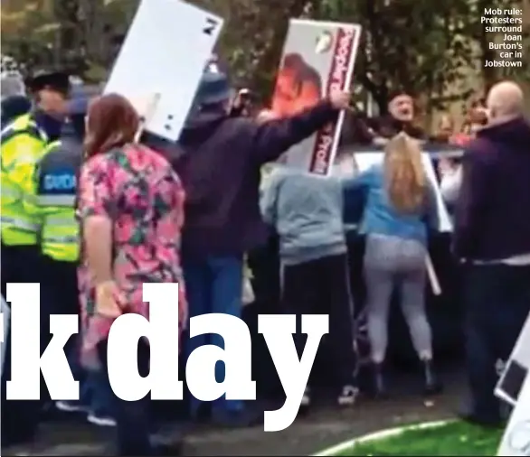  ??  ?? Mob rule: Protesters surround Joan Burton’s car in Jobstown