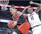  ?? ASSOCIATED PRESS FILE PHOTO ?? Houston guard Rob Gray, left, grabs a rebound Sunday in front of Cincinnati forward Gary Clark during the American Athletic Conference championsh­ip, in Orlando, Fla. America’s gambling industry predicts $10 billion will be bet on the March Madness...