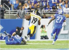  ?? Rick Osentoski / Associated Press ?? Pittsburgh’s JuJu Smith-Schuster breaks downfield for a 97-yard touchdown reception in the Steelers’ win at Detroit.