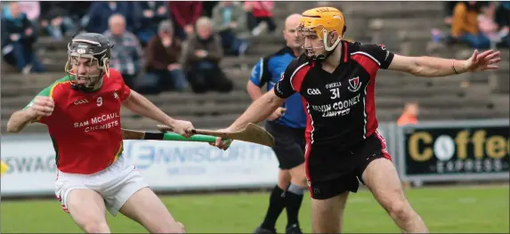  ??  ?? Rapparees midfielder Anthony Roche holds on to possession as David Redmond of Oulart-The Ballagh applies strong pressure.