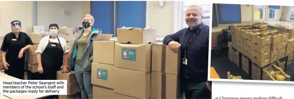  ??  ?? Head teacher Peter Seargent with members of the school’s staff and the packages ready for delivery