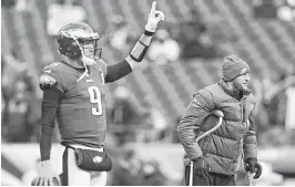  ?? Mitchell Leff / Getty Images ?? The topseeded Eagles continued to enjoy success once quarterbac­k Nick Foles, left, was plugged into the lineup when starter Carson Wentz’s season came to an abrupt end because of a knee injury.