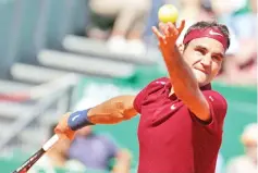  ?? — AFP photo ?? Switzerlan­d’s Roger Federer serves to France’s Jo-Wilfried Tsonga during their tennis match at the Monte-Carlo ATP Masters Series tournament on April 15, 2016 in Monaco.