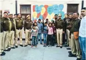  ?? PIC/MPOST ?? Children with police personnel at Sarojini Nagar police station