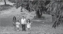  ?? ?? Her husband takes the children to the cemetery to pay their respects a month after her death from cancer. They remember what Jiu’er always said: “We are still with each other.”