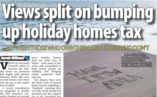  ??  ?? A beach in Nefyn bears a message from second home issue campaigner­s: ‘The right to live at home’ in Welsh