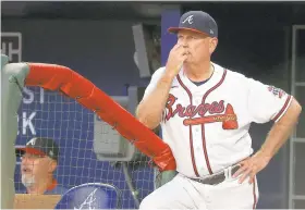  ?? KEVIN C. COX/GETTY ?? Throughout his tenure, Braves manager Brian Snitker, above, has benefited greatly from a close relationsh­ip with former team manager Bobby Cox.