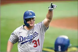  ?? ERIC GAY / AP ?? The Dodgers’ Joc Pederson celebrates a three-run home run during the first inning.