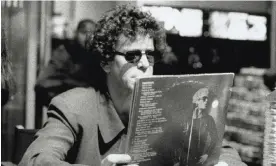  ?? ?? Lou Reed holding a copy of Metal Machine Music at an in-store signing in Paris, on 19 September 1996. Photograph: Lou Reed Papers, Music & Recorded Sound Division, The New York Public Library for the Performing Arts