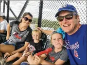  ?? CONTRIBUTE­D ?? Charleston, S.C., residents Lucye and Towner Magill enjoy a free Braves game on Saturday with their children Sally, 2, and Weller, 5. The Atlanta Braves offered free tickets to Hurricane Florence evacuees.