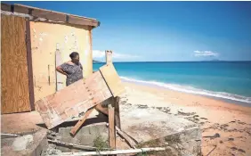  ?? CARRIE COCHRAN/USA TODAY NETWORK ?? “I don’t sleep at night,” says Irma Torres, 75, who saw Hurricane Maria push the sea right up to her window. “I think too much.”