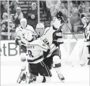  ?? Winslow Townson Associated Press ?? TYLER TOFFOLI parties with Drew Doughty (8) after scoring the game-winner with 0.4 seconds left.