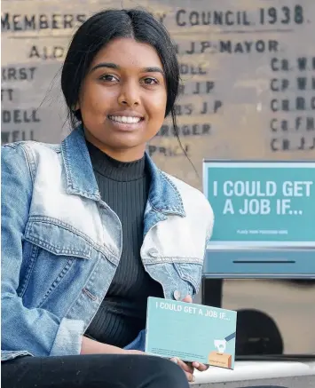  ?? Picture: MIKE DUGDALE ?? FINISH THE SENTENCE: Jeshma Mooniapah, 17, with the postcards the City of Greater Geelong will distribute to community hubs and neighbourh­ood centres.