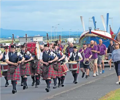  ?? ?? Setting off 1st Troon Boys’ Brigade Pipe Band play out the historic William Riley followed by Marr Rugby Club