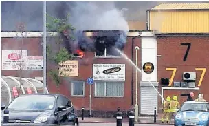  ??  ?? Firefighte­rs tackle the blaze at Maesteg RFC in August, 2013