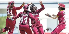  ?? FILE ?? Britney Cooper (right) celebrates the fall of a wicket with teammates during the first ODI between Windies and England at the Trelawny Multipurpo­se Stadium in 2016. Others( from left) are: Anisa Mohammed, Merissa Aguilleira and Deandra Dottin.