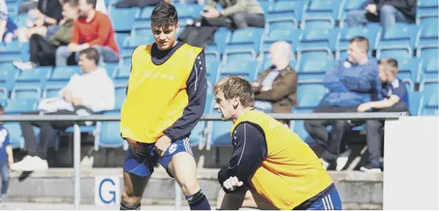  ??  ?? ON THE SIDELINES: Josh Macdonald (left) had been used as a substitute by Halifax this season until starting at Sutton on Tuesday night.