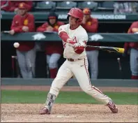  ?? NWA Democrat-Gazette/J.T. WAMPLER ?? Dominic Fletcher drives in Eric Cole with a base hit in the eighth inning to lift Arkansas to a 7-6 victory over USC on Sunday at Baum Stadium in Fayettevil­le.