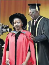  ?? /LULAMILE FENI ?? Nompumelel­o Kapa receives her doctorate degree at a ceremony at the University of Fort Hare.