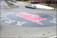  ?? File Photo/NWA Democrat-Gazette ?? The Razorback logo at Dickson Street and Arkansas Avenue in Fayettevil­le is seen freshly built in 2004.