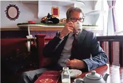  ??  ?? David Teie, a US composer and cellist, drinks a cup of tea during an interview to promote his new album “Music for Cats”.