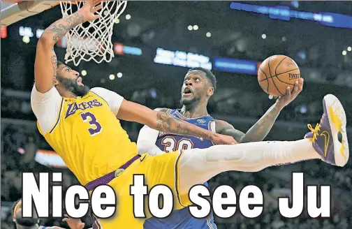  ?? AP ?? FRIENDLY FIRE: Anthony Davis falls backward as he tries to block a Julius Randle shot last season. Davis hit the court hard and missed multiple weeks. He was also out when the Knicks and Lakers met at the Garden earlier this season (below).