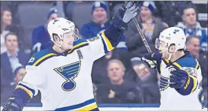  ?? CP PHOTO ?? St. Louis Blues right wing Vladimir Tarasenko (91) celebrates his game-winning goal with defenceman Kevin Shattenkir­k (22) after scoring against the Toronto Maple Leafs in overtime of an NHL game Thursday in Toronto.