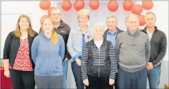  ??  ?? Retiring deputy fire chief, Sue Barnett, centre, with some of the 11-strong Herbertvil­le Rural Fire volunteers.