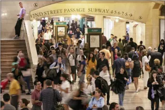  ?? RICHARD DREW — THE ASSOCIATED PRESS ?? In this photo, people pass through New York’s Grand Central Terminal.