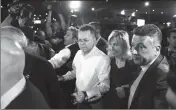  ?? ASSOCIATED PRESS ?? PASTOR ANDREW BRUNSON (center left) and his wife Norine Brunson arrive at Adnan Menderes airport for a flight to Germany after his release following his trial in Izmir, Turkey, on Friday,