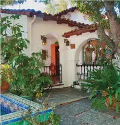  ??  ?? RIGHT Red Tile Style is another name for these houses. This 1934 hacienda in San Marino, Calif., also boasts porthole windows, arches, and a colorful Hispano–Moresque tile fountain.